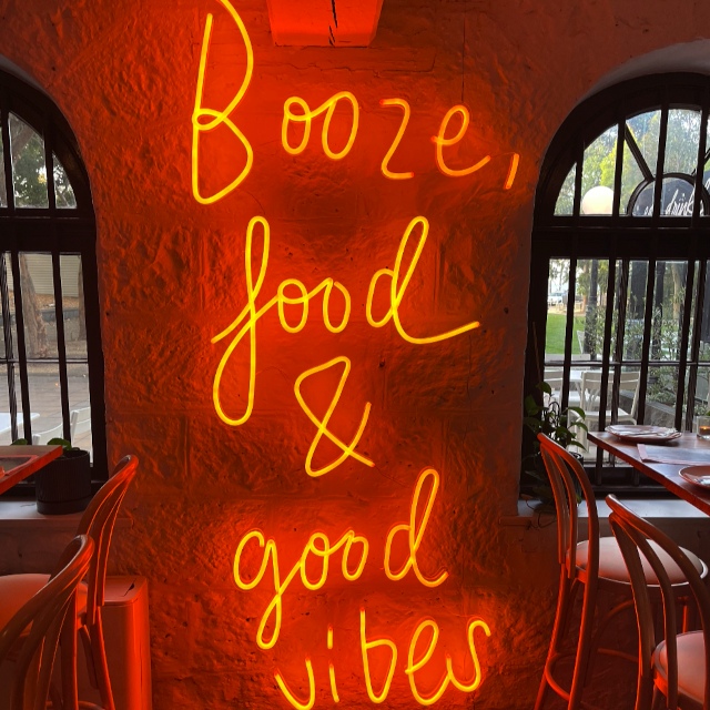 Orange Custom Neon® hand written restaurant sign @justinlaneest