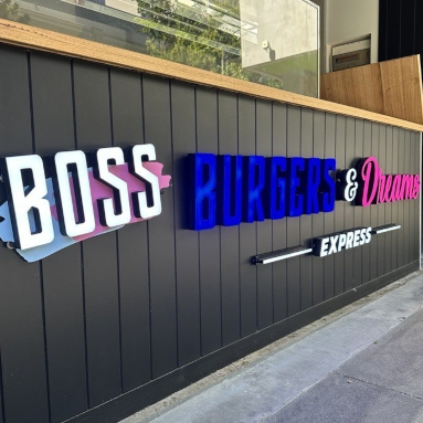 White blue and pink Boss Burgers & Dreams burger bar sign in face lit channel letters