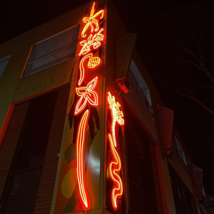 Purple IP67 waterproof rated building sign by Custom Neon® mounted near the roof @jaguarroomdenver