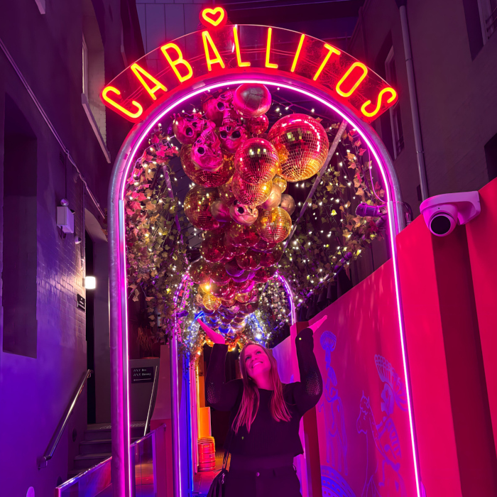 Insta post of a person under the @caballitosperth archway outside outside the restaurant featuring a Custom Neon® Caballitos sign