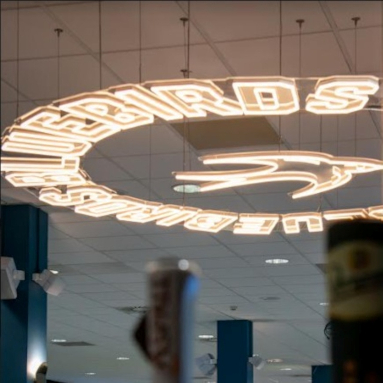 Custom Neon® circular logo sign suspended from the ceiling @cardiffcityfc
