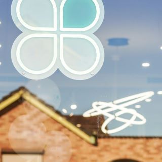 Custom Neon® white and mint logo sign @cloverhomesau