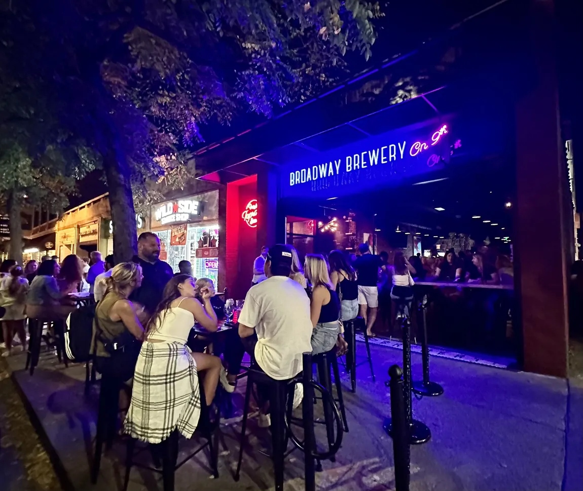 Illuminated exterior signage by Custom Neon® on bars and restaurants