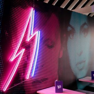 Pink and blue lightning bolt on Bowie inspired wall @wahwahgee made by Custom Neon®