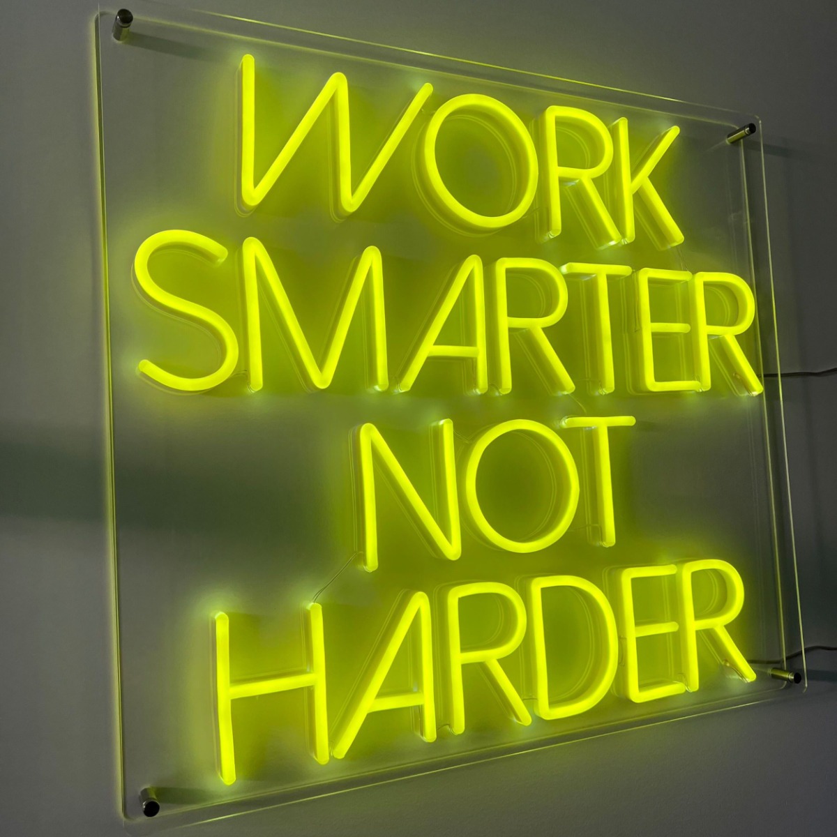 Custom Neon® Sign wall-mounted in an acrylic open box