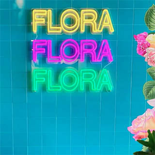 Flora multi-colored business name sign by Custom Neon™