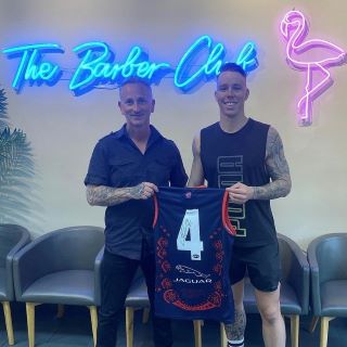 Ice Blue Custom Neon® logo wall sign @thebarberclubmelbourne