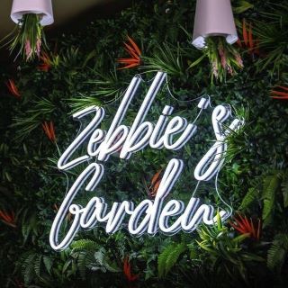 White Custom Neon® bar name sign @zebbiesgarden
