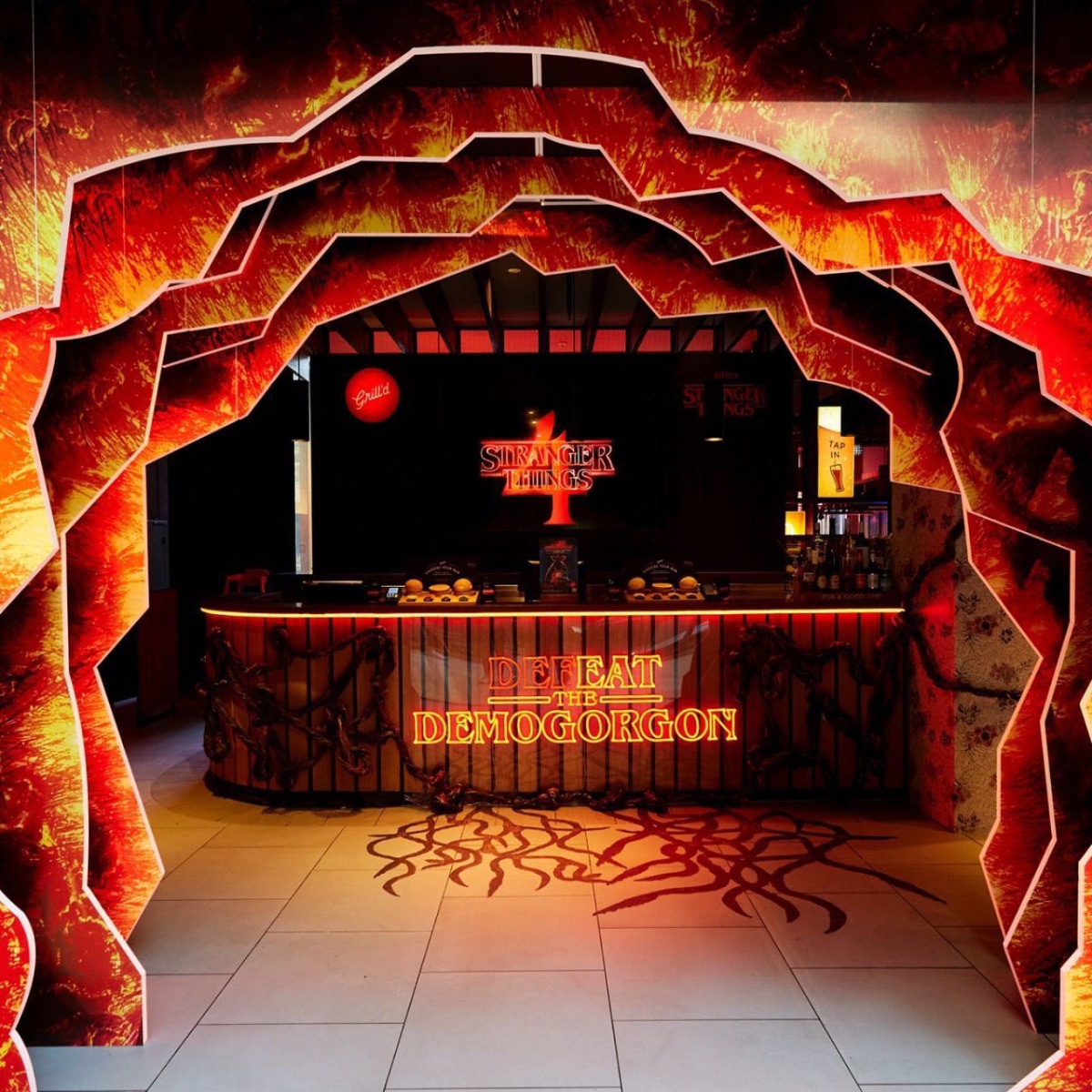 Custom Neon® red Defeat the Demogorgon sign for Netflix x Grill'd retail promotion @grilldburgers @seekeragency