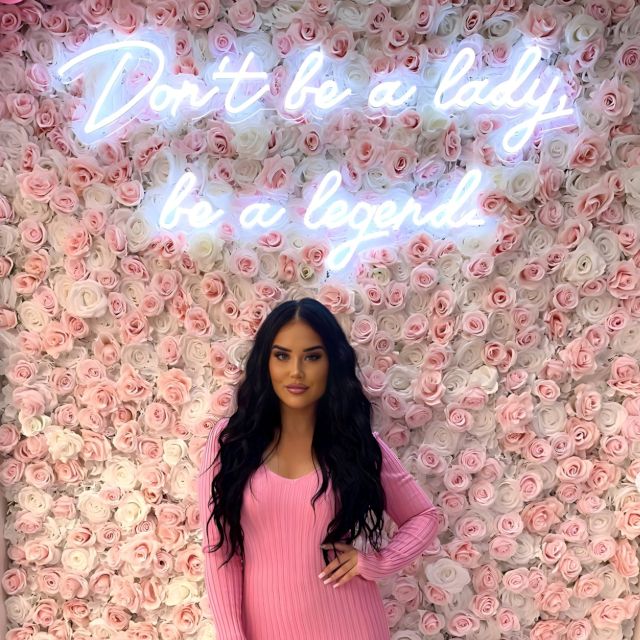 Don't be a lady be a legend Custom Neon® sign on a rose wall @jglowbeautyllc