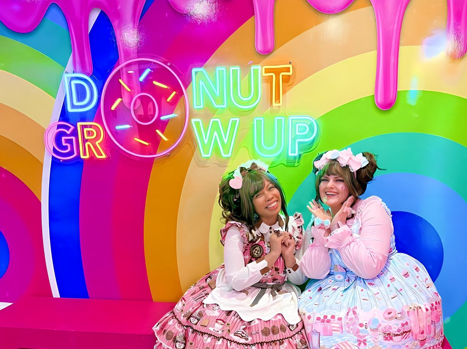 Donut Grow Up multicolored Custom Neon® sign on a rainbow selfie wall @sundaedonuts @snazzytazzes