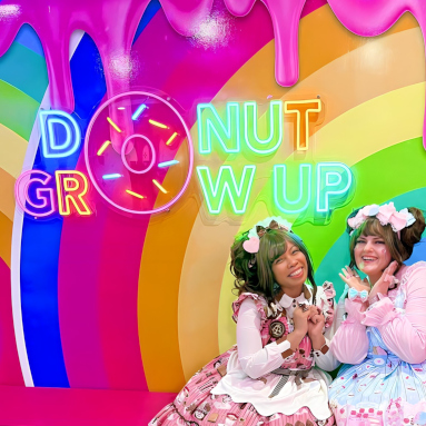 Donut Grow Up Custom Neon® sign on the rainbow colored Insta wall @sundaedonuts photo@snazzytazzes