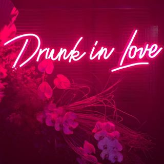 Custom Neon® pink Drunk in Love sign as wedding decor
