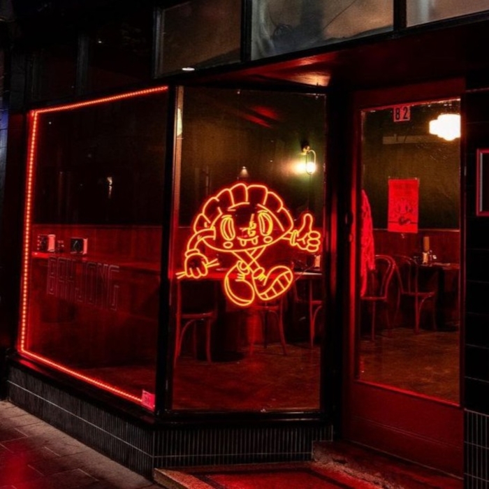 Red restaurant window art by Custom Neon® @bahjong_geelong