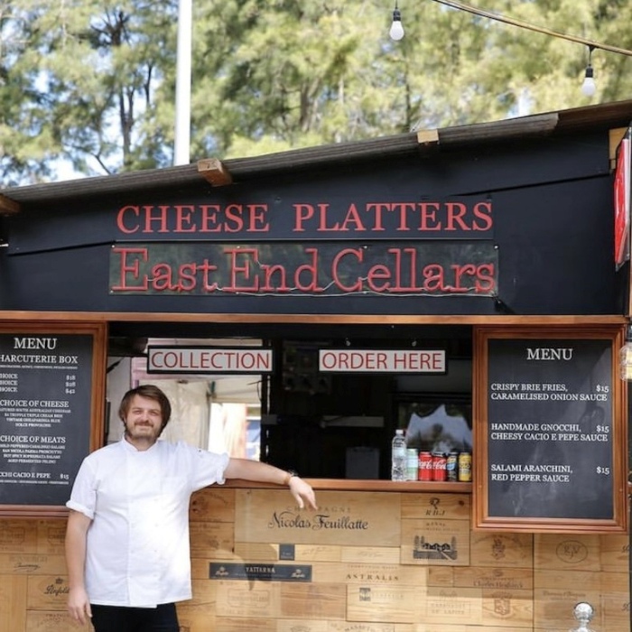 @eastendcellars red Custom Neon® outdoor rated waterproof sign on the front of a kiosk