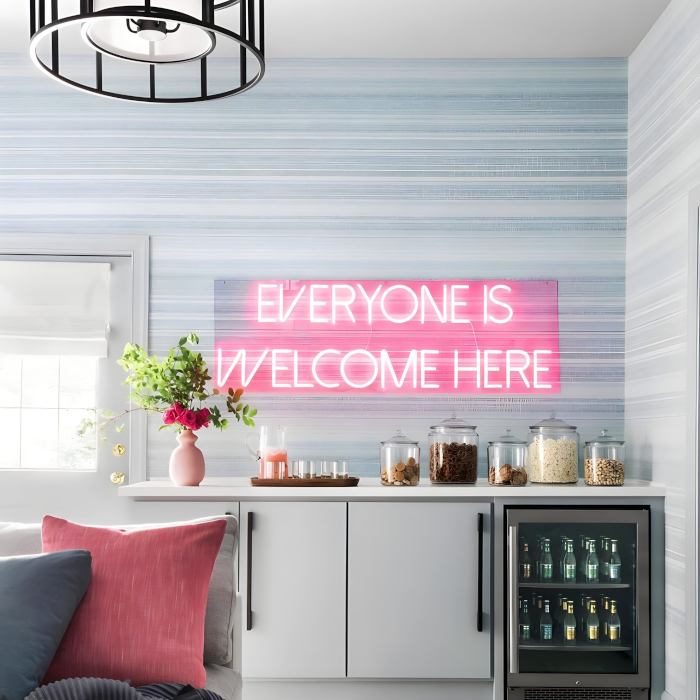 Custom Neon® Everyone Is Welcome Here light red sign in teen hideout designed by @bpatrickflynn