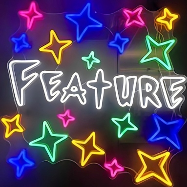 Custom Neon® store name sign in white surrounded by stars on a dark wall @feature