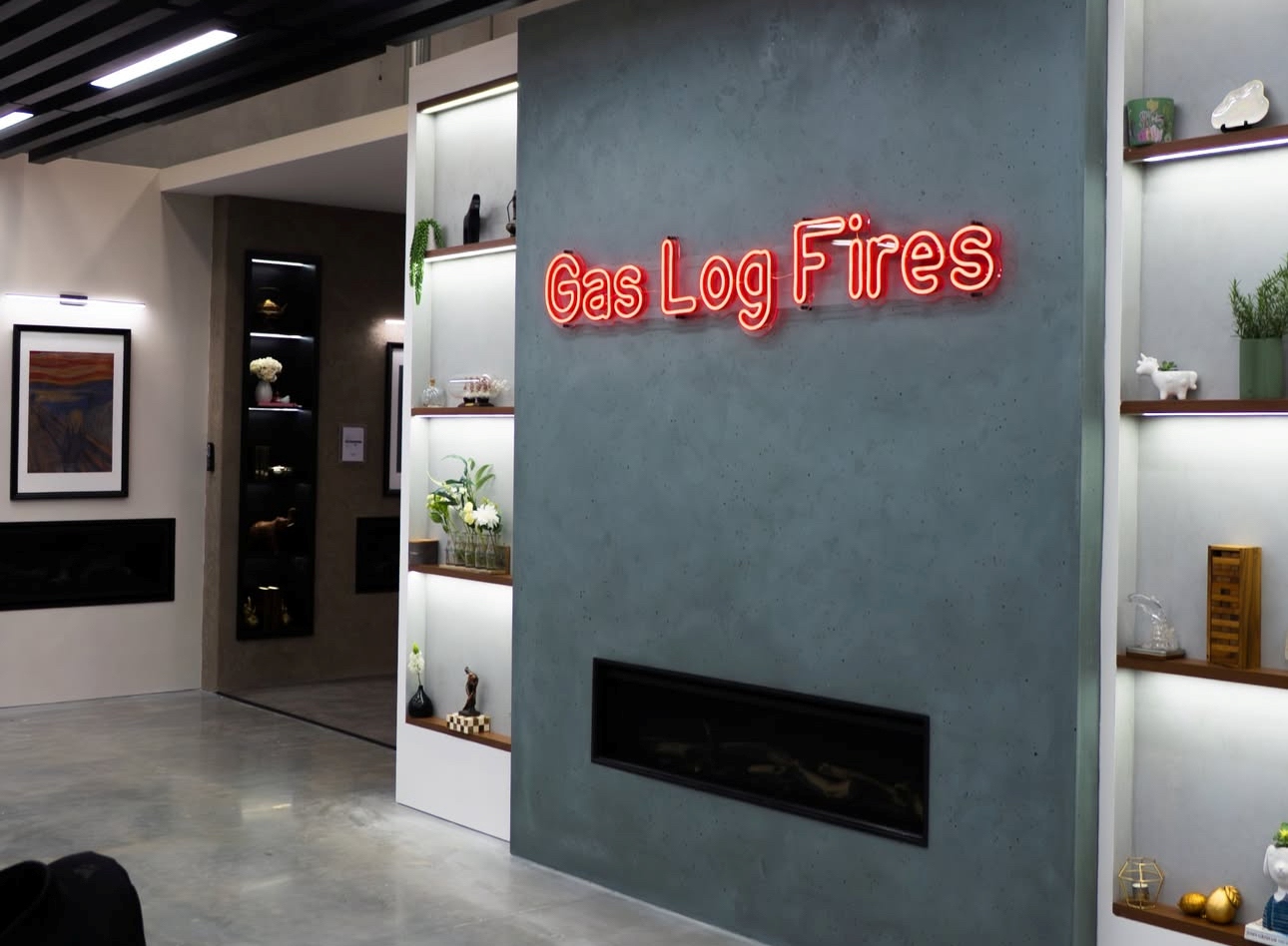 Gas Log Fires red LED neon double lined display sign made by Custom Neon® mounted on a grey wall in the Pivot Stoves showroom