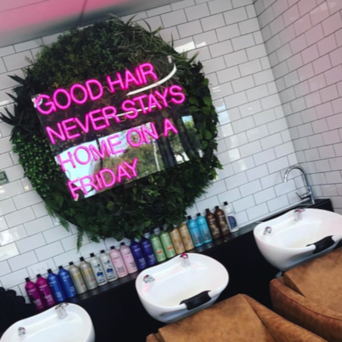 Pink hair salon quote sign on green wall by Custom Neon® @amitiehair.co