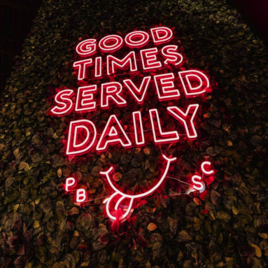 Large red Custom Neon® sign of the @ponyboat_socialclub slogan