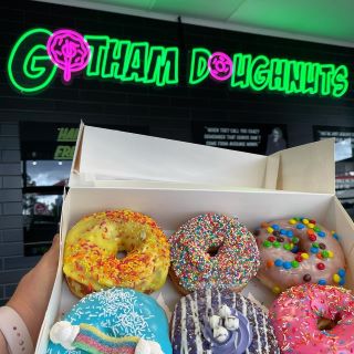 Custom Neon® pink and green logo sign @gotham.doughnuts-green