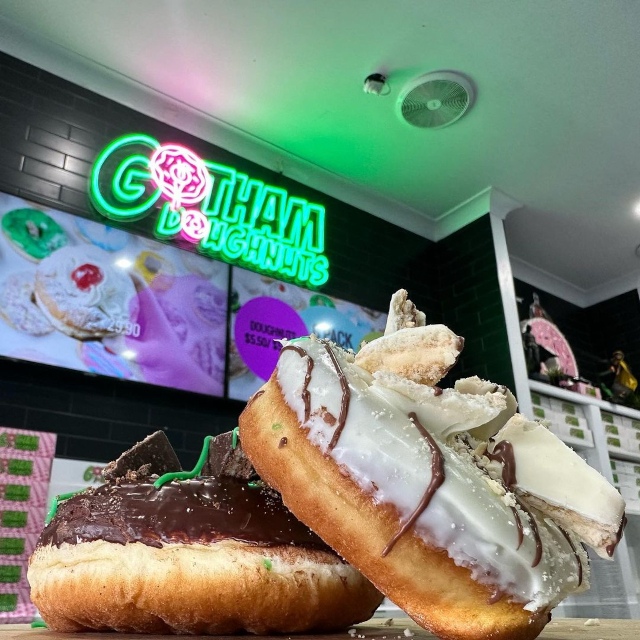 Pink and green Custom Neon® bakery logo sign @gotham.doughnuts