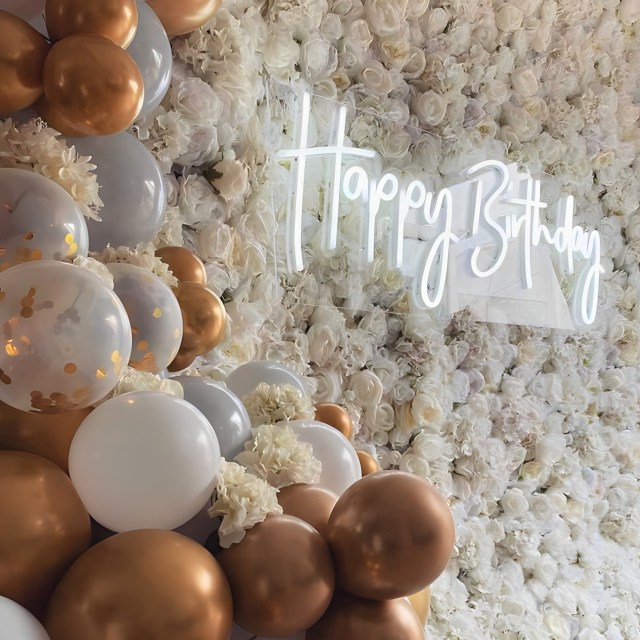 Happy Birthday sign by Custom Neon® on white floral wall @effortless_elegance_uk
