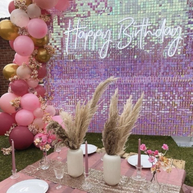 Happy Birthday Custom Neon® sign on a shimmer wall at an outdoor birthday picnic party - decor by @effortless_elegance_uk