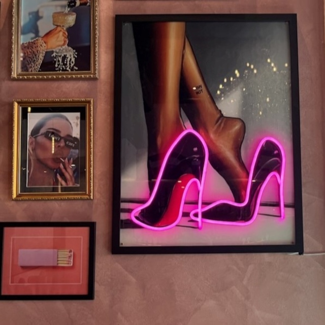 Custom Neon® framed UV print artwork of black high heals with hot pink LED neon outline on the wall @fargoandco @ausvenueco