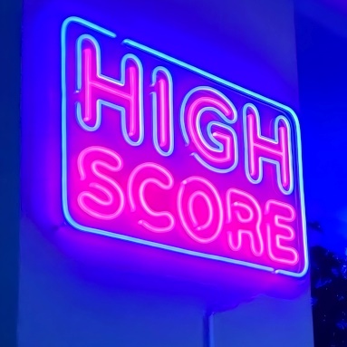High Score vintage style Custom Neon® framed gaming sign in blue and pink LED neon