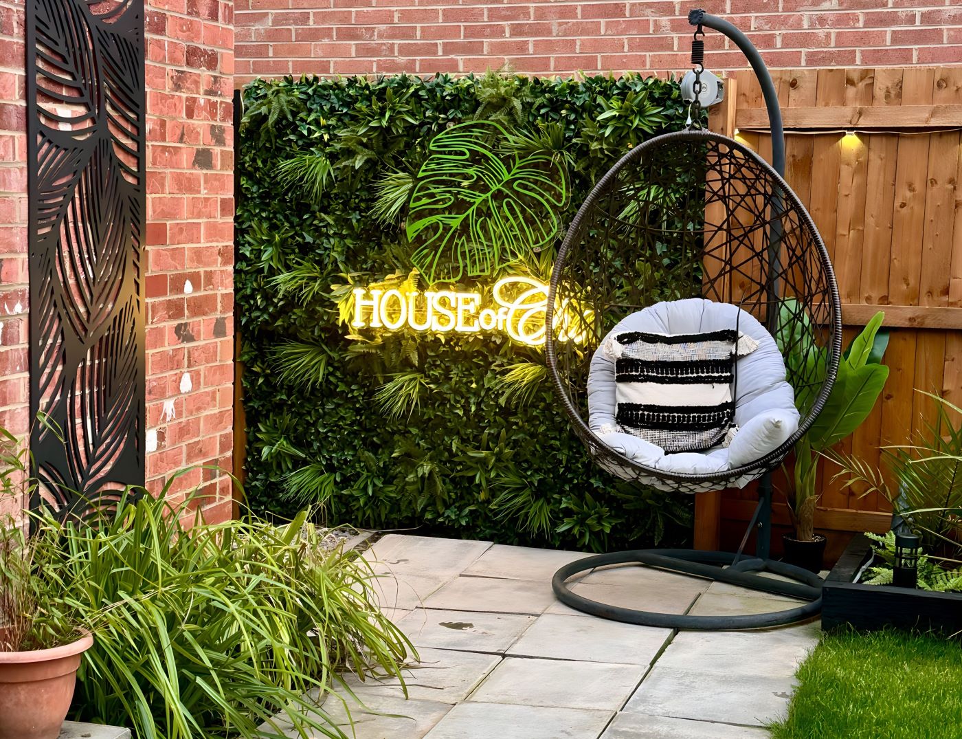 Custom Neon® home name sign in the garden @houseofchi