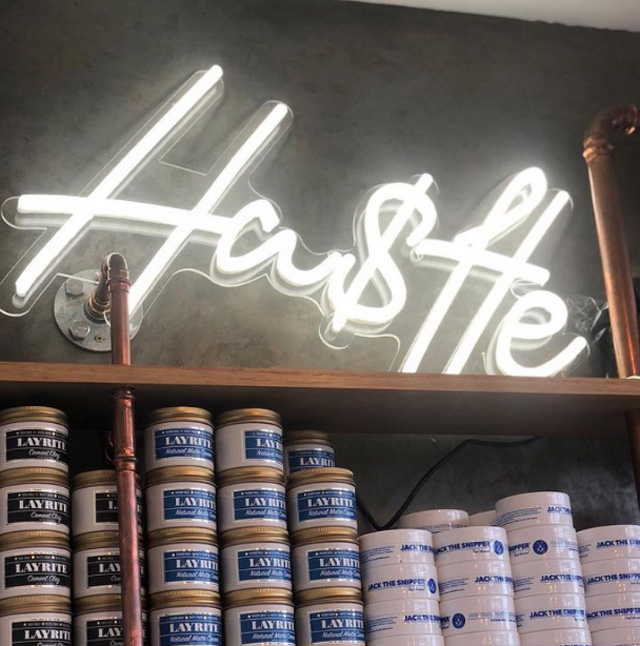 White Custom Neon&reg; Hu$tle sign @theresidentbarber