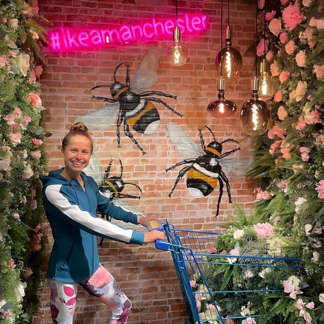 #ikeamanchester pink Custom Neon® sign on a brick wall with a bee mural and floral edging @ikeauk