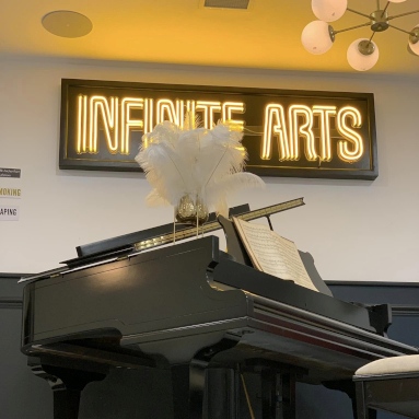 Marquee neon font arts venue sign example