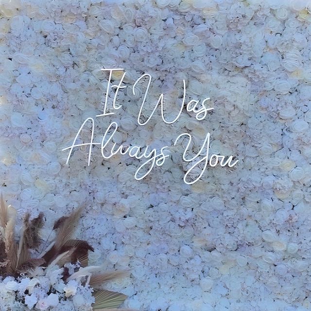 It Was Always You white Custom Neon® wedding sign on a white rose photo wall @effortless_elegance_uk