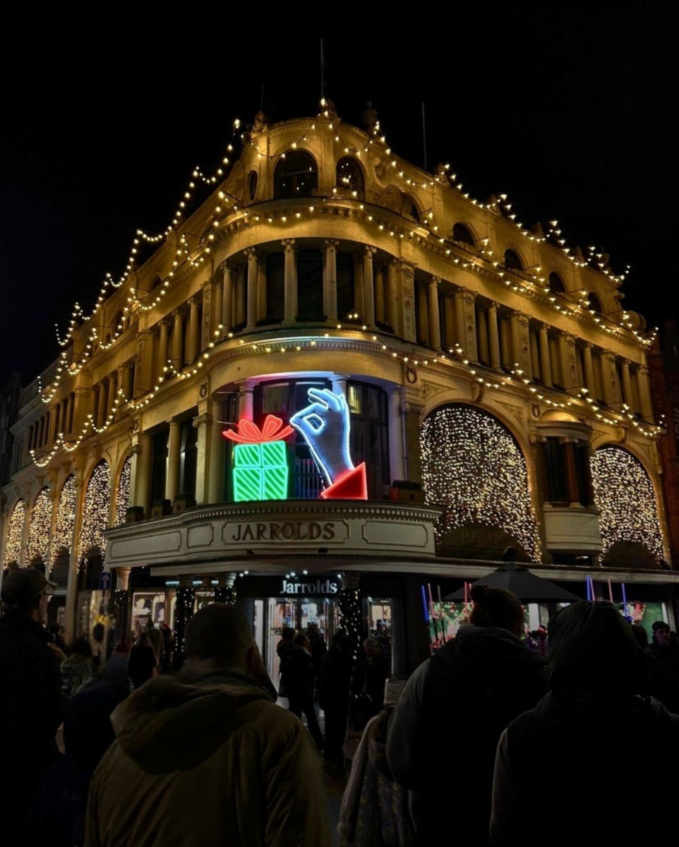Custom Neon® lighted Christmas decorations on the storefront of @jaroldnorwich department store