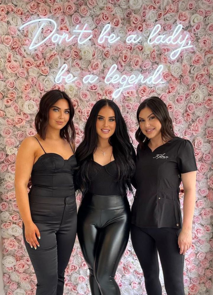 White Custom Neon® sign on pink floral wall @jglowbeautyllc