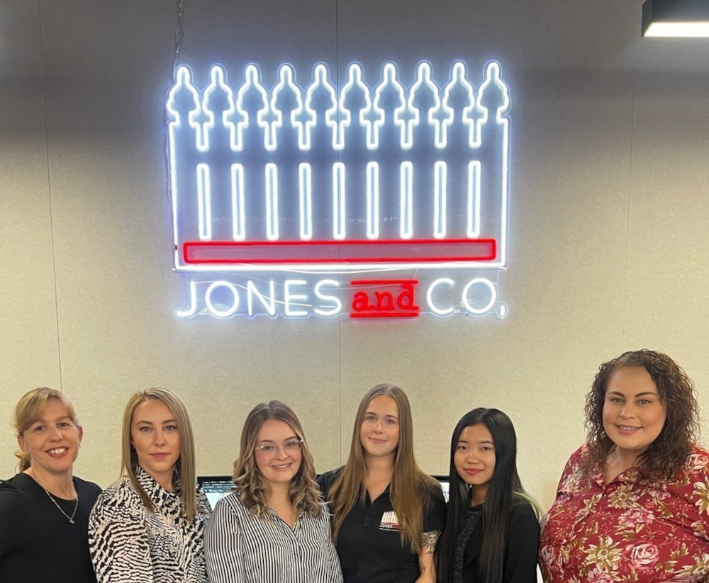 Custom Neon® red and white logo for jonesandcoproperty.com.au