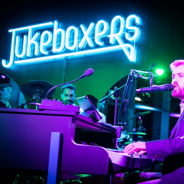 Blue Custom Neon® live music venue logo @jukeboxers