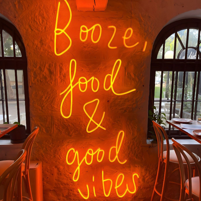 Booze food and good vibes Custom Neon® restaurant quote sign @justinlaneest