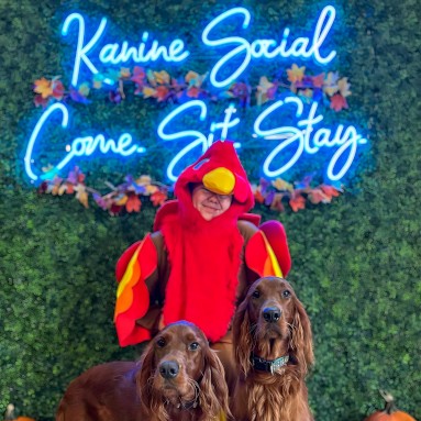 Light blue @kaninesocial branded Custom Neon® selfie wall backdrop sign