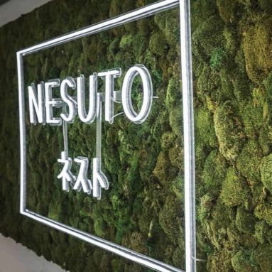 Custom Neon® Japanese Katakana white office sign on moss wall @nesuto.coworking