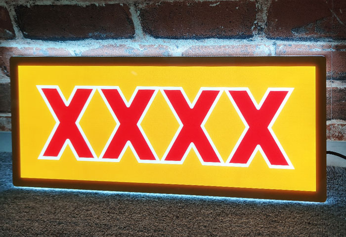 Slim lightbox sign with logo for the XXXX beer brand