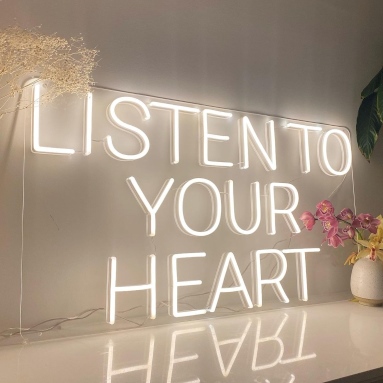 Pink Custom Neon® Cook Drink & Wine sign above a Smeg fridge