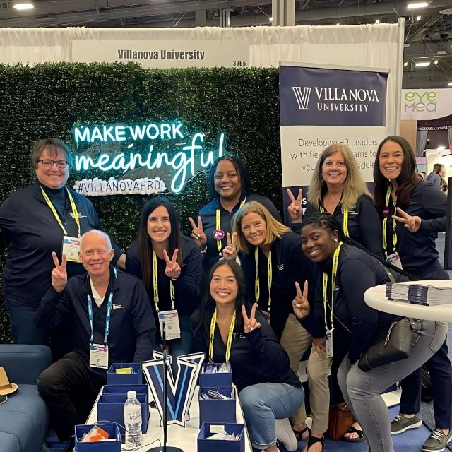 Custom Neon® LED neon UV print conference sign on grass wall @villanovahrd @shrmofficial