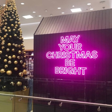 Custom Neon® pink May Your Christmas Be Bright sign in the @davidjones department store