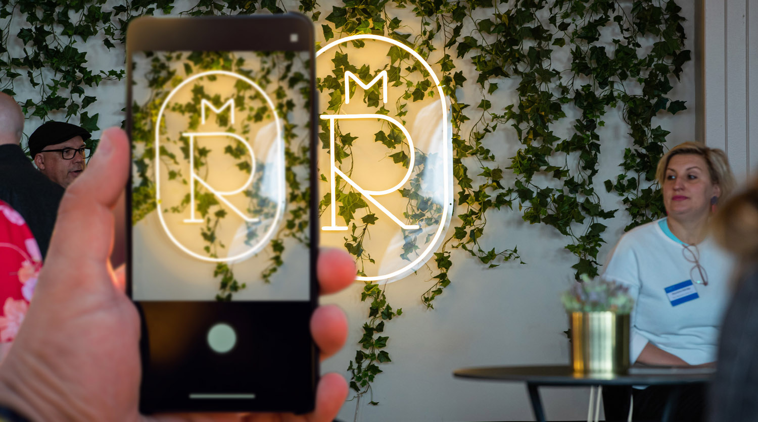 Custom Neon® Melbourne Royal Show logo on wall with vines