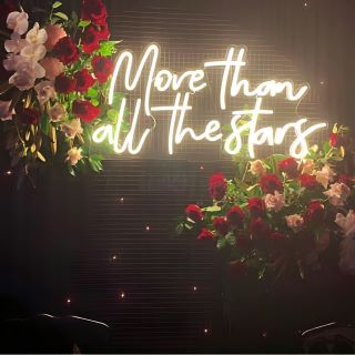 Custom Neon® wedding quote sign More than All the Stars surrounded by roses