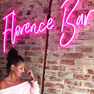 Custom Neon™ personalised bar sign on brick wall