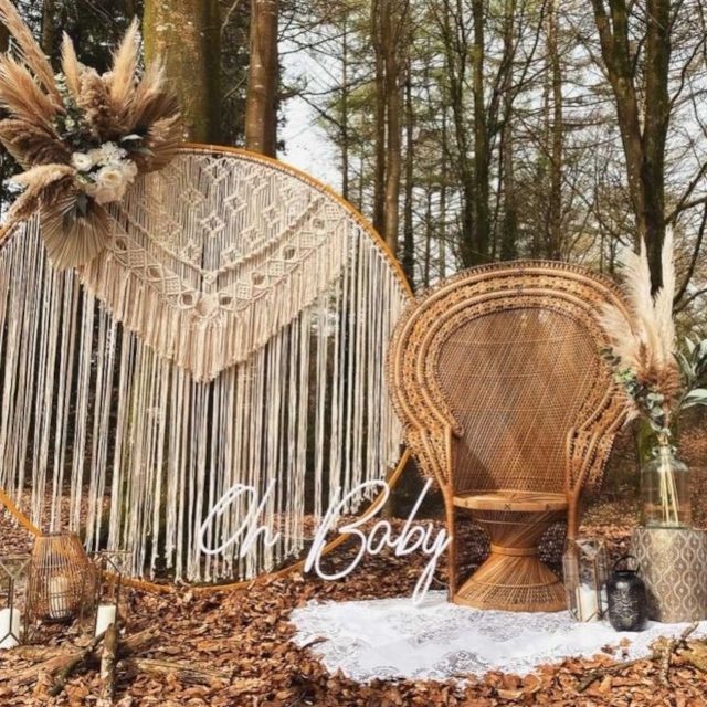 White Oh Baby Custom Neon® sign outdoors in a woodland setting surrounded by nature goddess decor @effortless_elegance_uk